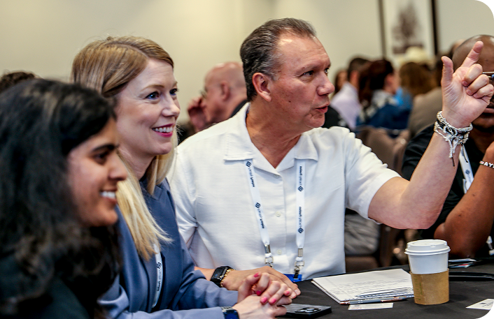 Attendees connecting and exchanging ideas at IFMA’s Facility Fusion Conference & Expo, showcasing innovation and the future of facility management.